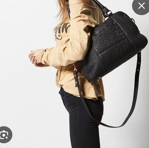 Status Anxiety Black Bubble War With Obvious Bag